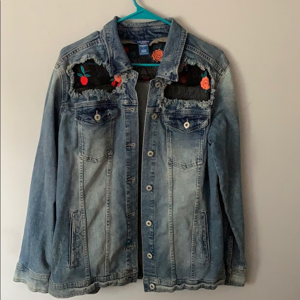 A denim jacket with black net floral accent